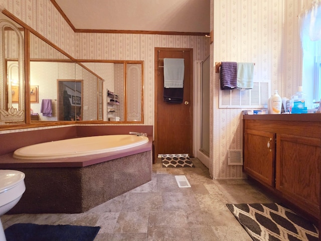 bathroom featuring vanity, a shower with shower door, and ornamental molding