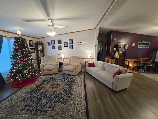 living room featuring crown molding, ceiling fan, and hardwood / wood-style flooring