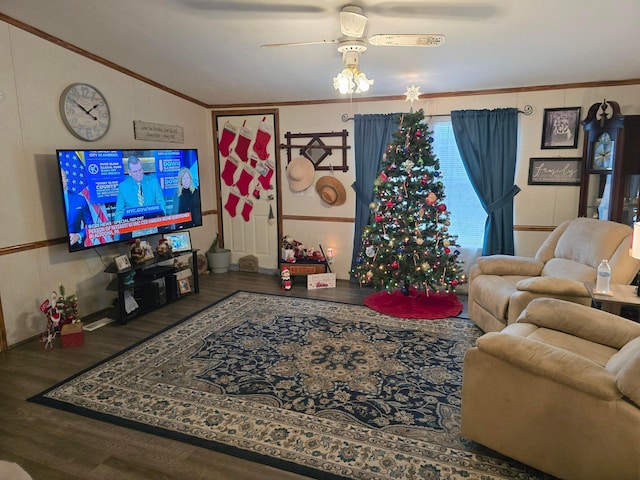 living room with hardwood / wood-style floors, ceiling fan, and ornamental molding