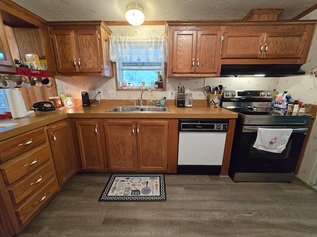 kitchen with extractor fan, sink, dishwasher, dark hardwood / wood-style floors, and stainless steel electric range