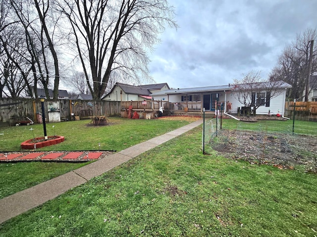 view of yard with a wooden deck