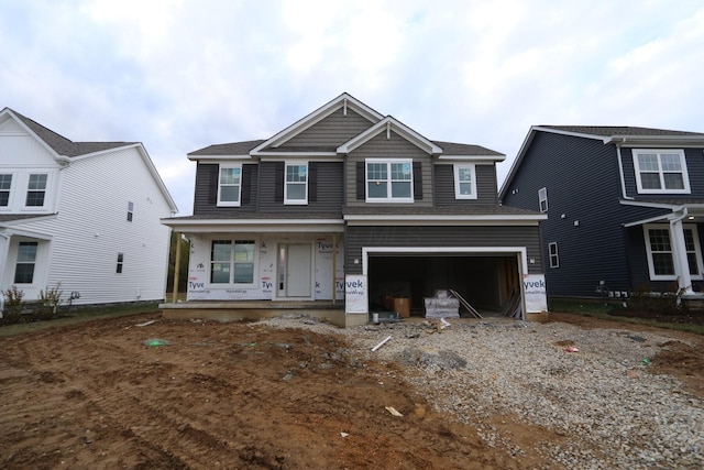 view of front of home with a garage and covered porch