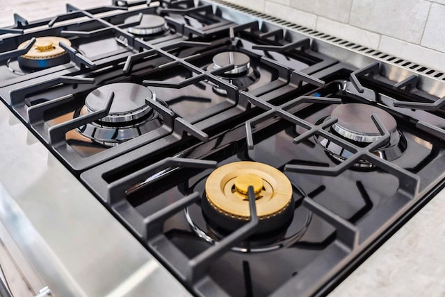 interior details featuring stovetop and stainless steel range with gas stovetop