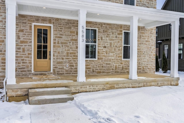 view of snow covered property entrance