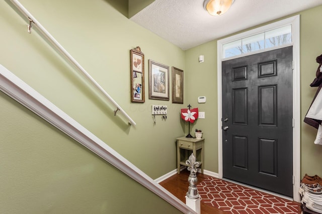 entryway featuring a textured ceiling