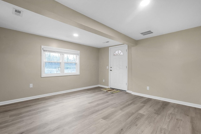 unfurnished room with light hardwood / wood-style floors