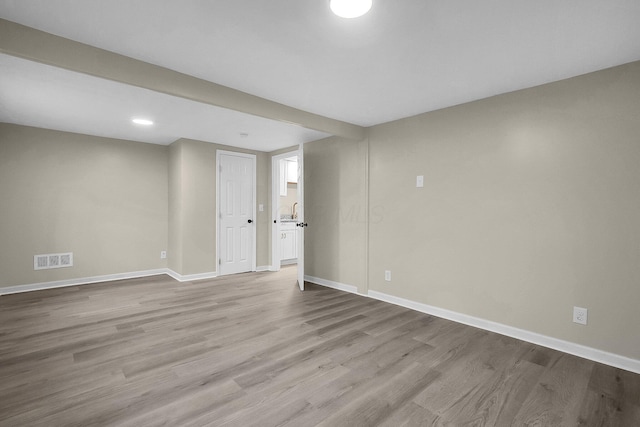 empty room with light hardwood / wood-style floors