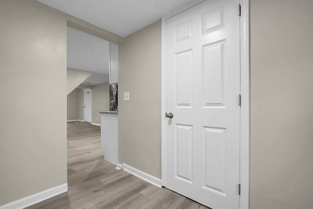 hall with light hardwood / wood-style flooring