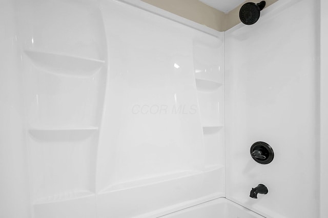 bathroom with shower / bathtub combination