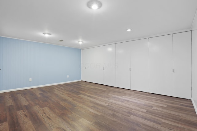 interior space with visible vents and wood finished floors