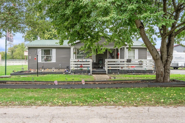 view of front of house with a front lawn and a porch