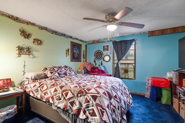 carpeted bedroom featuring a textured ceiling and ceiling fan