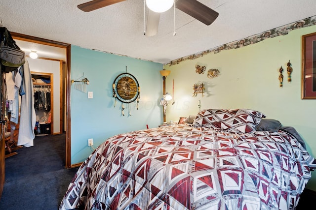 bedroom featuring ceiling fan, a closet, carpet, and a textured ceiling