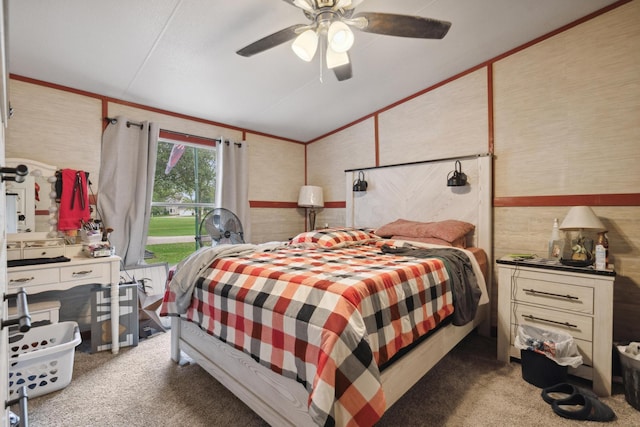 carpeted bedroom featuring ceiling fan and vaulted ceiling