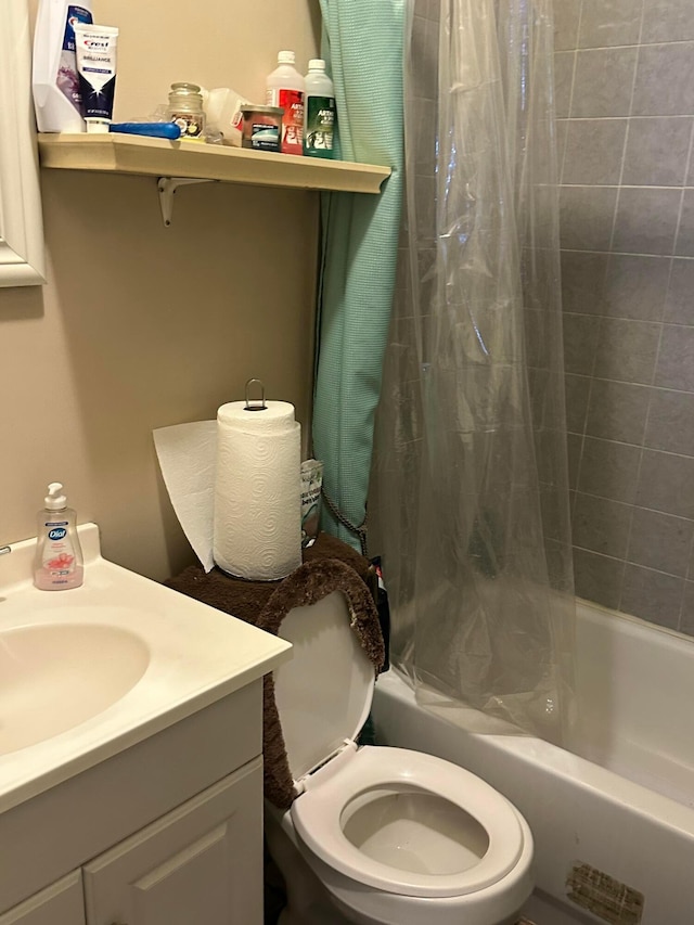 full bathroom with vanity, shower / bath combination with curtain, and toilet