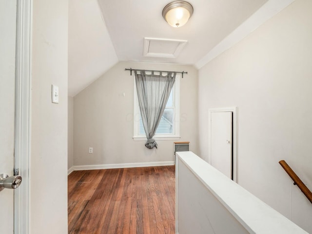 additional living space featuring dark hardwood / wood-style flooring and vaulted ceiling