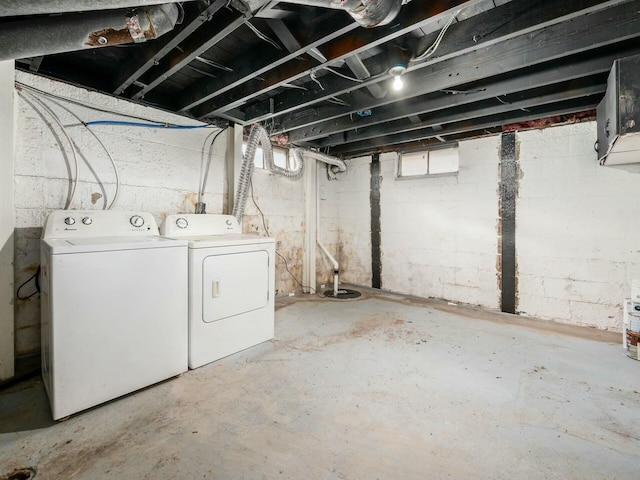 basement featuring plenty of natural light and washer and clothes dryer