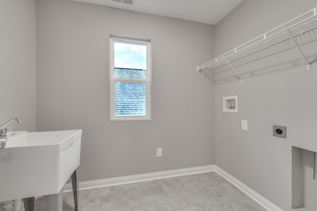 laundry room with washer hookup, sink, and hookup for an electric dryer