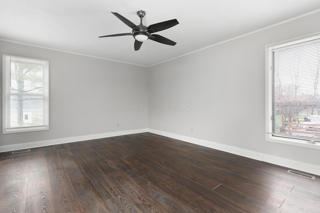 spare room with ceiling fan, crown molding, and wood-type flooring