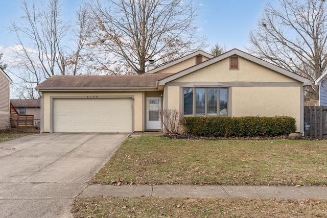 ranch-style house featuring a garage and a front lawn