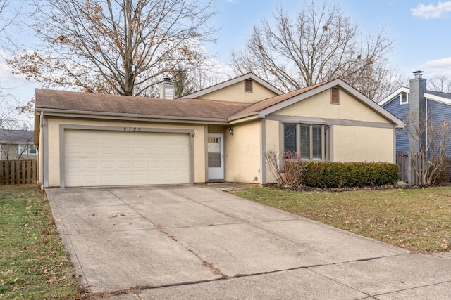 single story home featuring a front yard and a garage