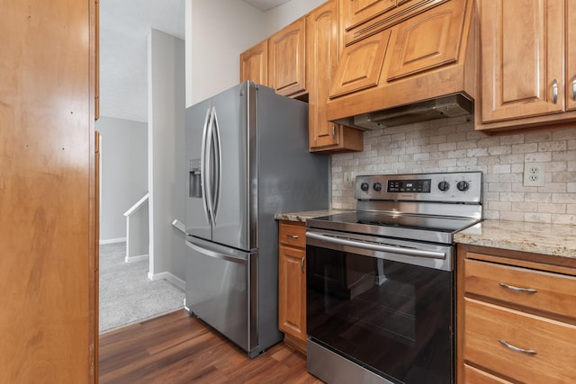 kitchen with stainless steel appliances, light stone counters, dark hardwood / wood-style flooring, decorative backsplash, and custom range hood