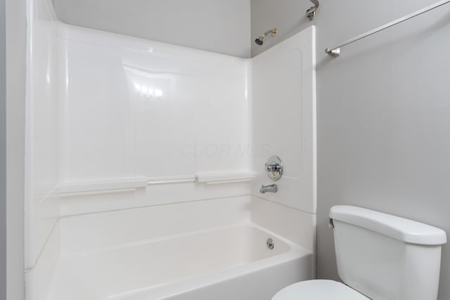 bathroom with toilet and shower / bath combination