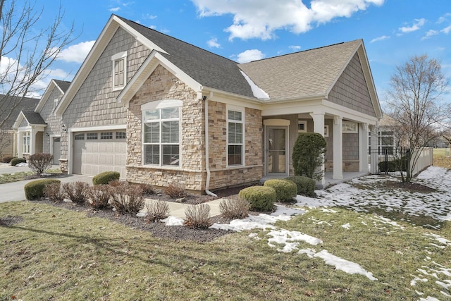 view of front of house with a garage and a front lawn