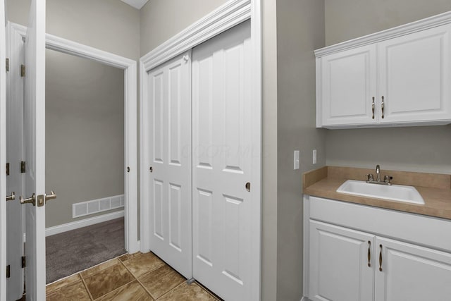 bathroom with vanity and tile patterned floors