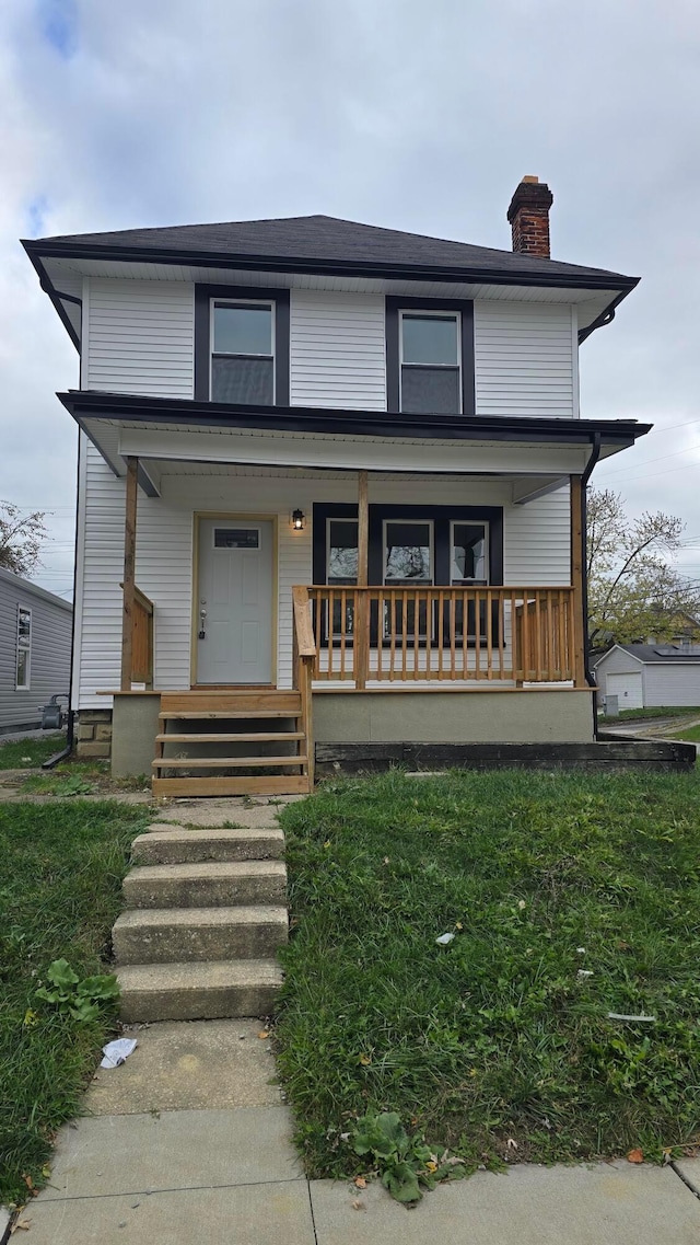 view of front of property featuring covered porch and a front lawn