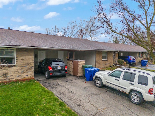 single story home featuring a carport