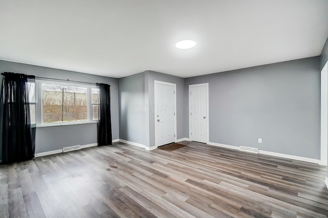 unfurnished room featuring light hardwood / wood-style floors