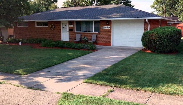 ranch-style home with a front yard and a garage