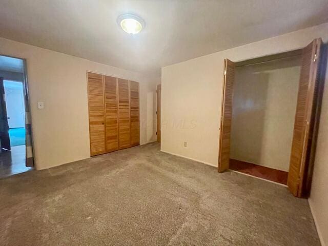 unfurnished bedroom with carpet