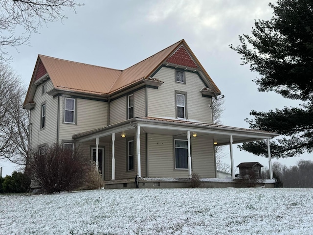 victorian house featuring covered porch