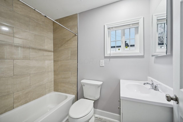 full bathroom featuring vanity, toilet, and tiled shower / bath combo