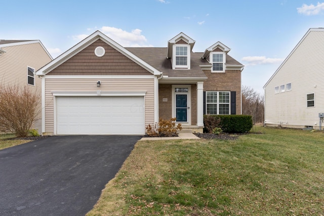 view of front of house with a garage and a front yard