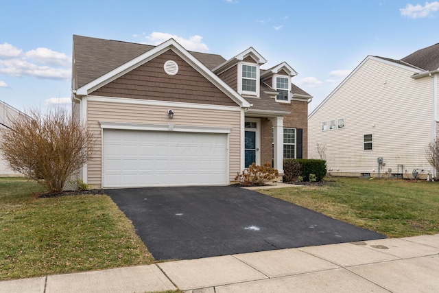 view of front facade with a front yard and a garage