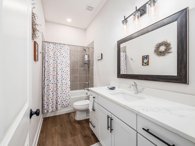 full bathroom with shower / tub combo, wood-type flooring, vanity, and toilet