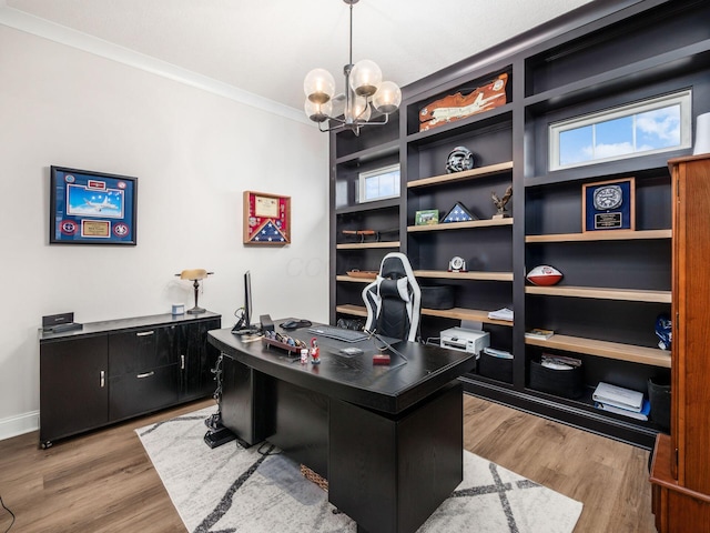 home office with crown molding, light hardwood / wood-style flooring, and a chandelier