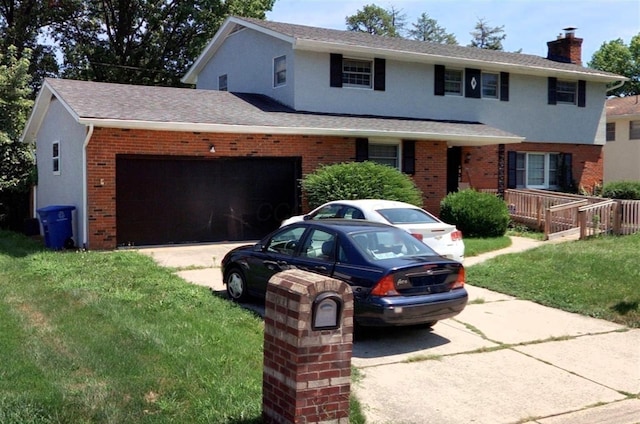 view of front facade featuring a garage and a front yard