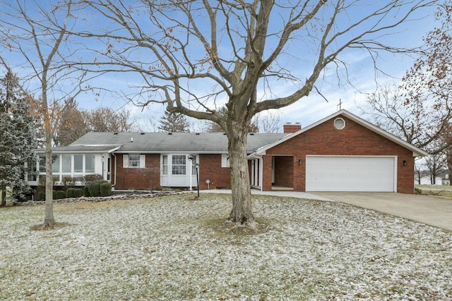 6015 Lithopolis Winchester Rd, Canal Winchester, OH 43110 - ranch-style home with brick siding, an attached garage, driveway, a chimney, and a sunroom