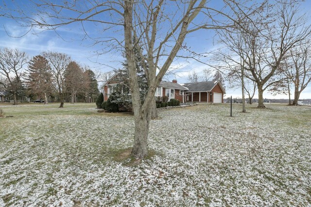 6015 Lithopolis Winchester Rd, Canal Winchester, OH 43110 - view of front of property with a garage and a chimney