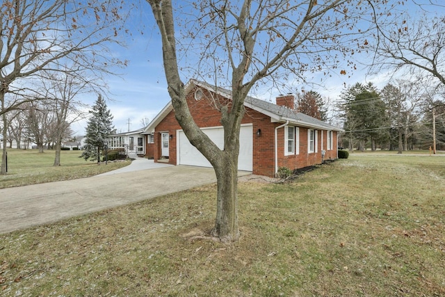 view of home's exterior featuring a yard and a garage