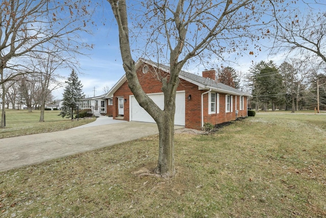 6015 Lithopolis Winchester Rd, Canal Winchester, OH 43110 - view of home's exterior with brick siding, driveway, a chimney, a garage, and a lawn