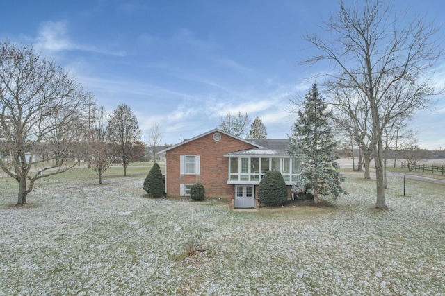 6015 Lithopolis Winchester Rd, Canal Winchester, OH 43110 - view of side of home with brick siding, a sunroom, a shingled roof, and french doors