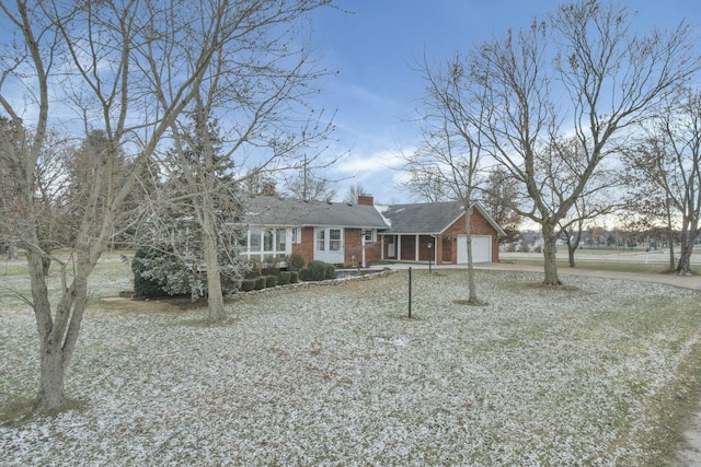 6015 Lithopolis Winchester Rd, Canal Winchester, OH 43110 - ranch-style house with brick siding, driveway, an attached garage, and a chimney