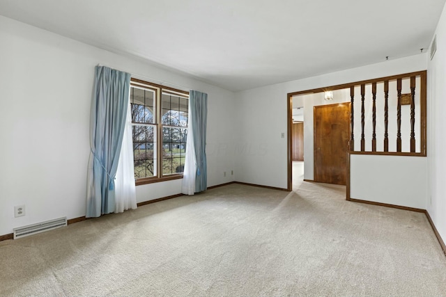 spare room with light carpet