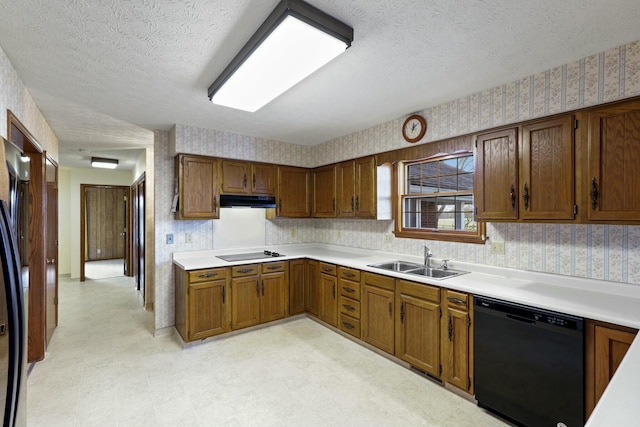 kitchen with dishwasher, sink, refrigerator, a textured ceiling, and electric stovetop