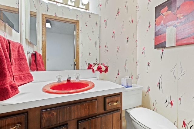 bathroom with vanity and toilet